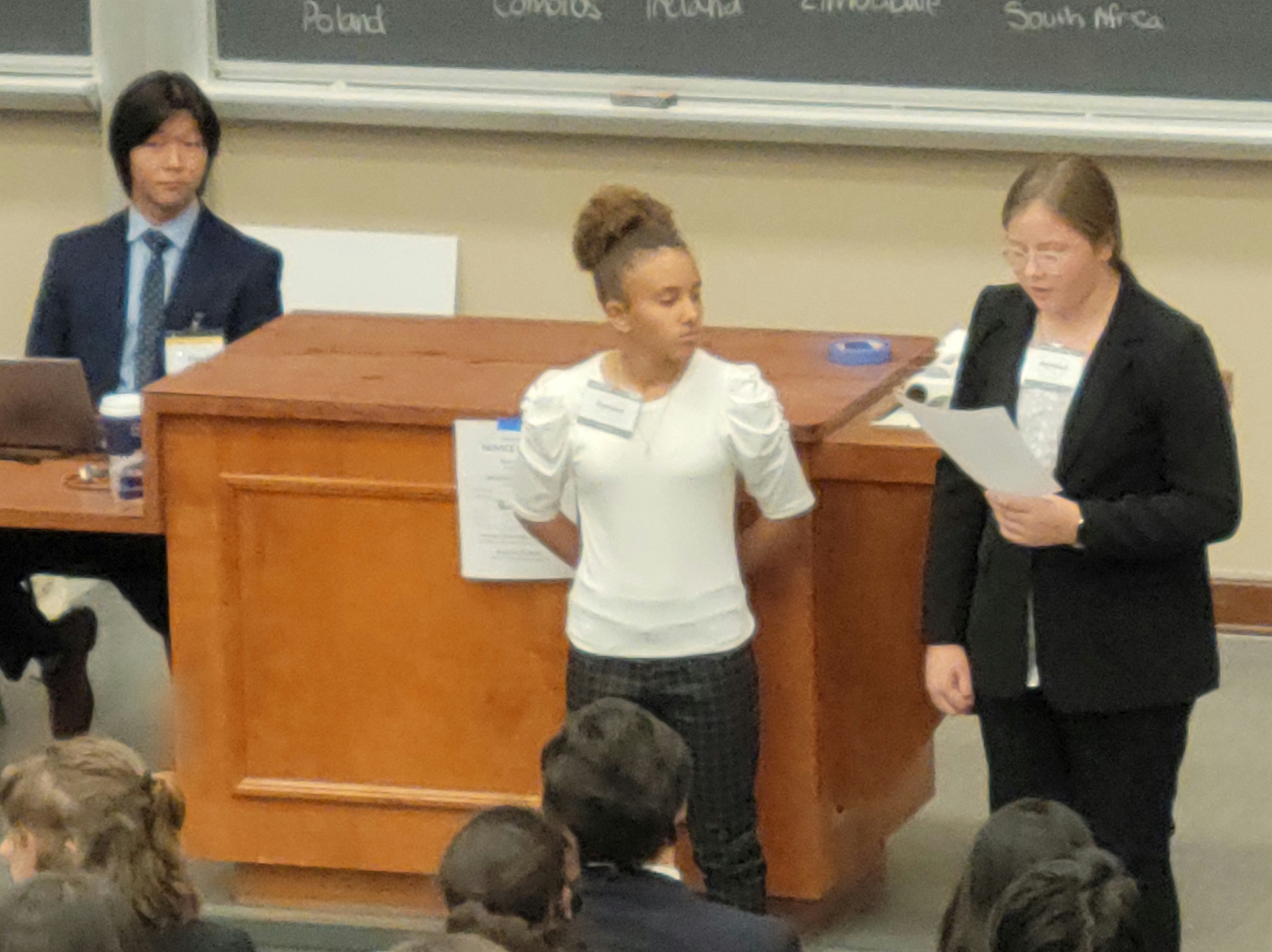 Students debating at a conference